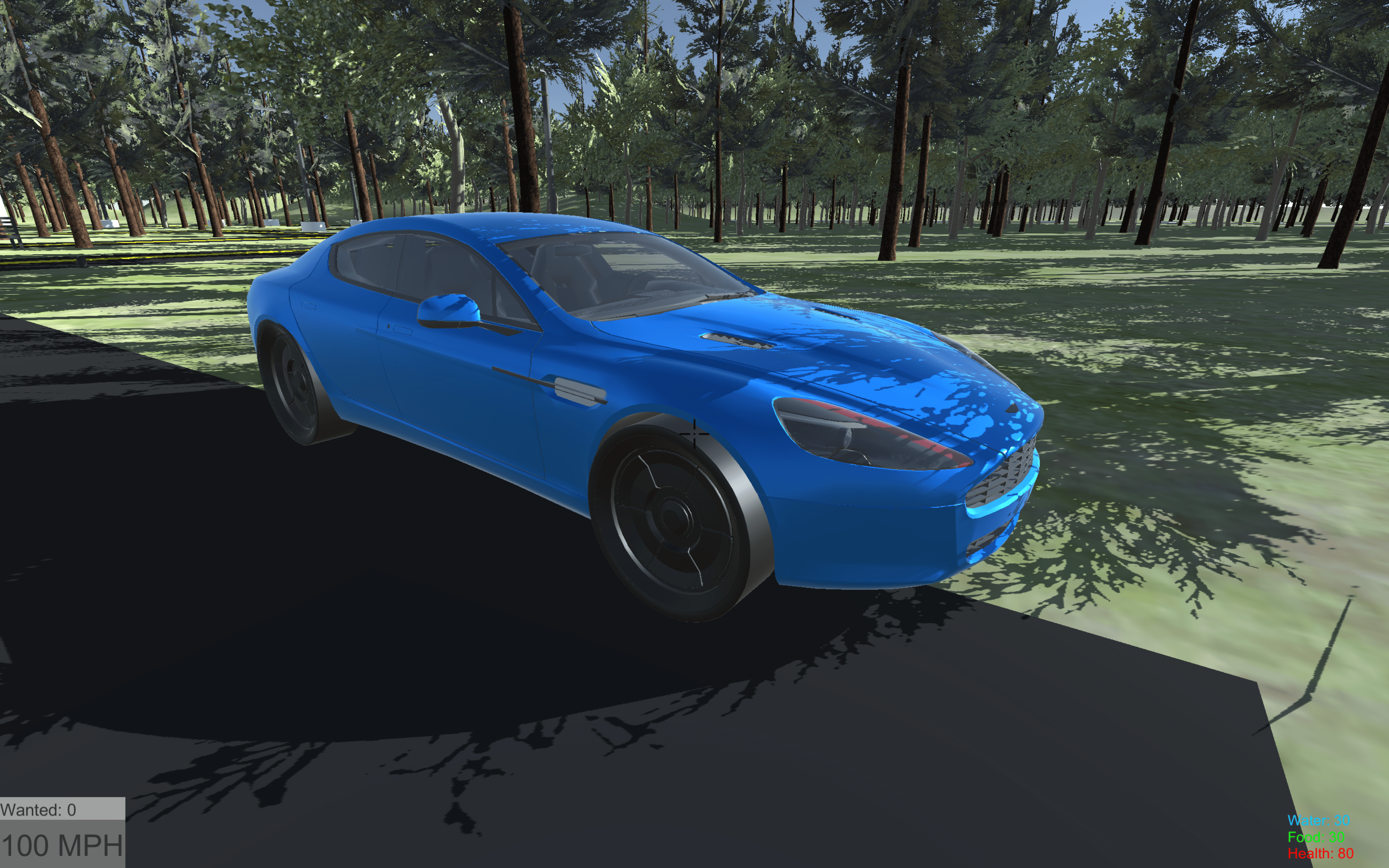 Close up of virtual Blue Aston Martin DB8 parked beside the road shown from the front left corner. Trees can be seen behind.